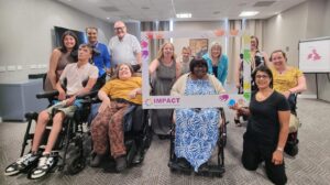 IMPACT's Co-production Advisory Group pose for a team photo